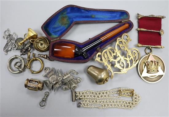 A silver gilt medallion, cased pipe and other items.